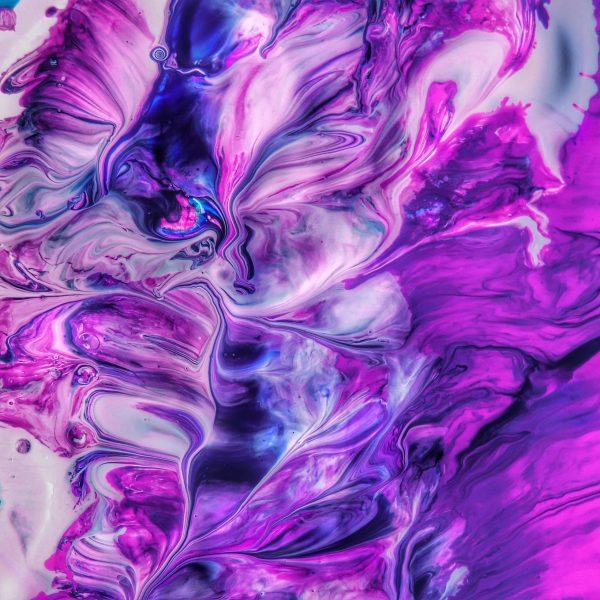 Vivid abstract artwork featuring bold purple and pink swirls, creating a dynamic and energetic visual.